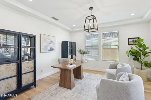 a living room with furniture and a rug