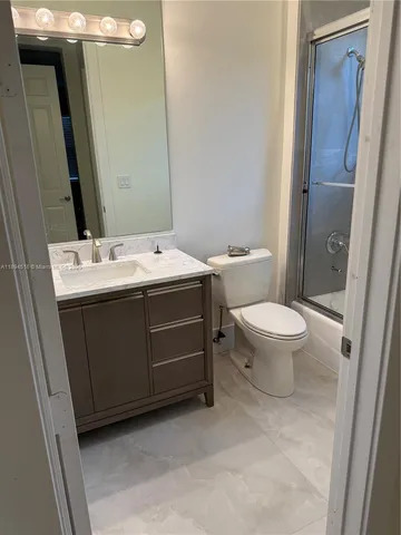 a bathroom with a sink and a toilet