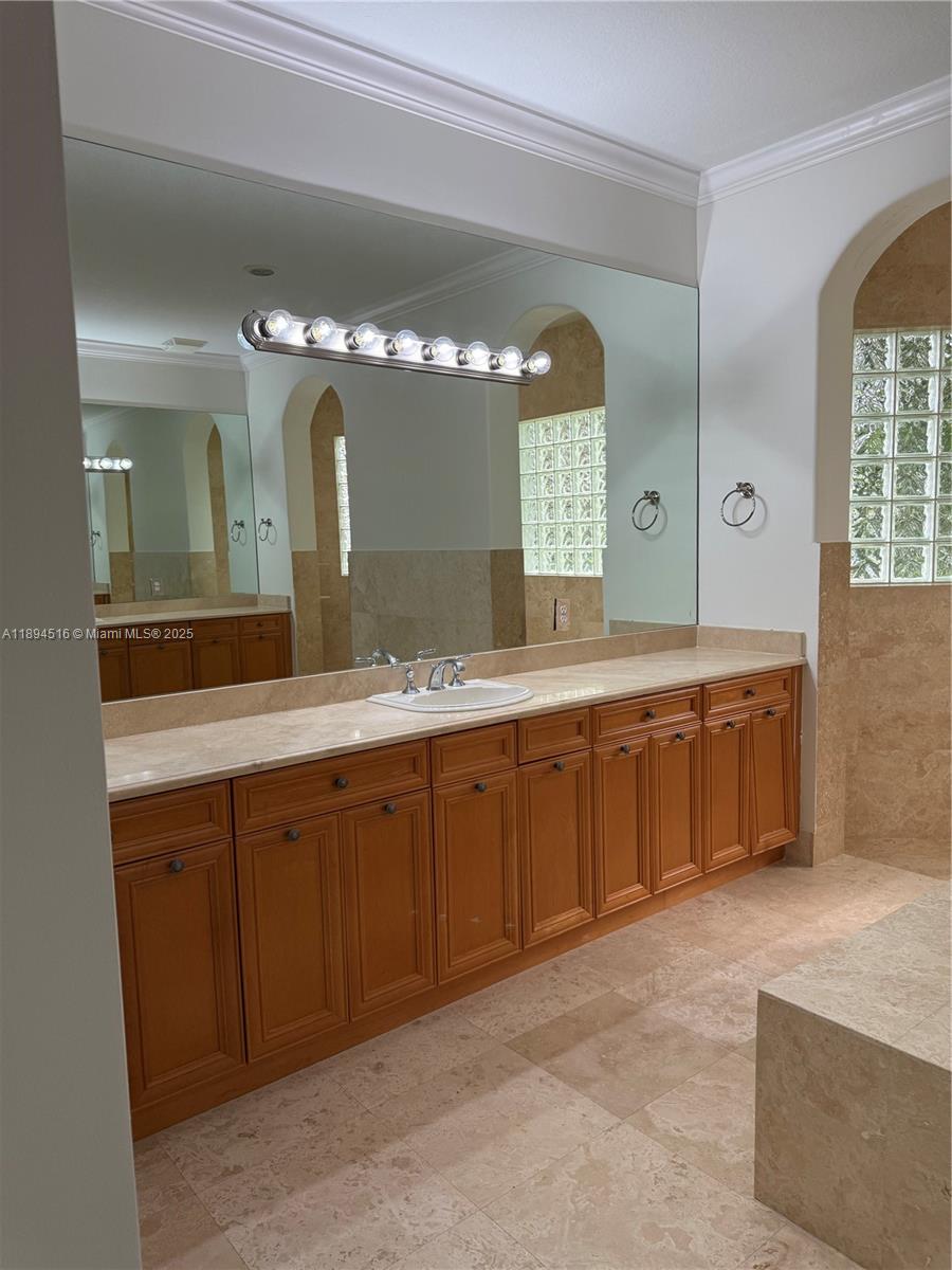 2273 Phoenix Avenue Davie, FL 33324 - Photo 18 of 20 a spacious bathroom with a double vanity sink and a large mirror