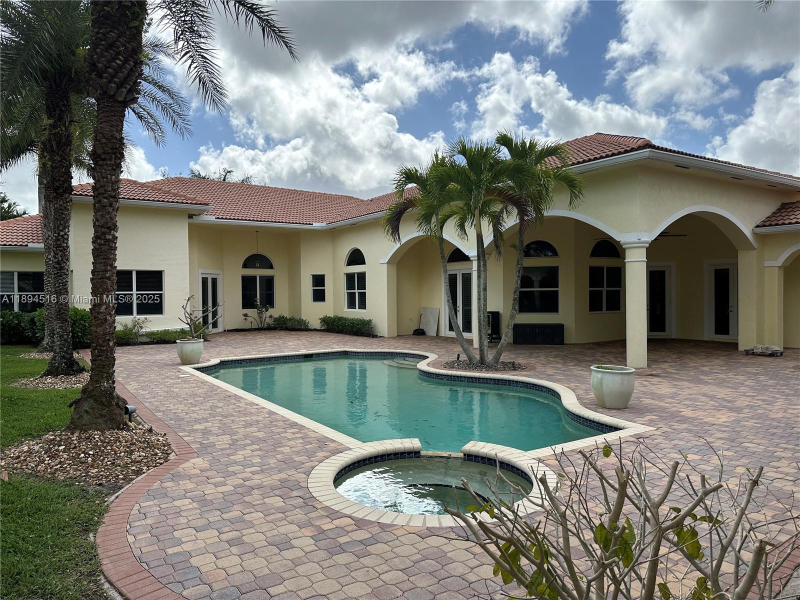 2273 Phoenix Avenue Davie, FL 33324 - Photo 2 of 20 a view of a house with swimming pool and a yard
