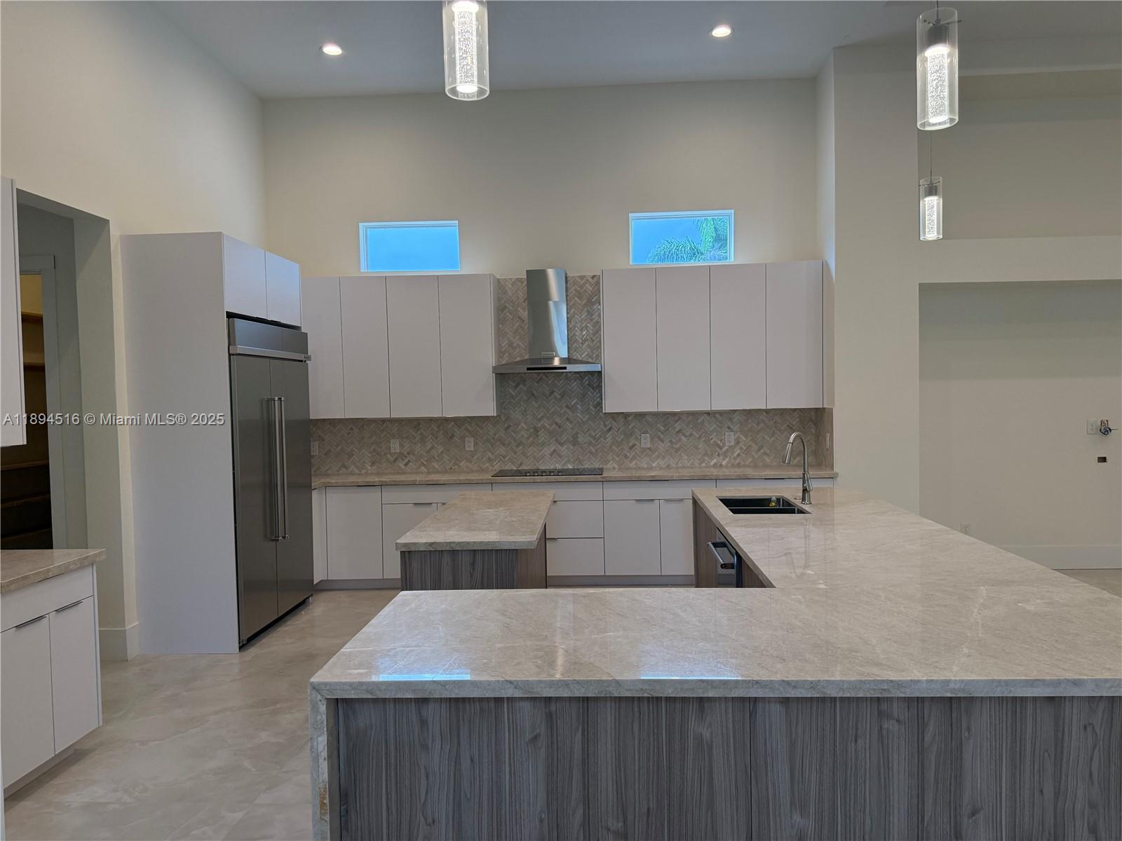 2273 Phoenix Avenue Davie, FL 33324 - Photo 5 of 20 a kitchen with kitchen island a sink stainless steel appliances and cabinets