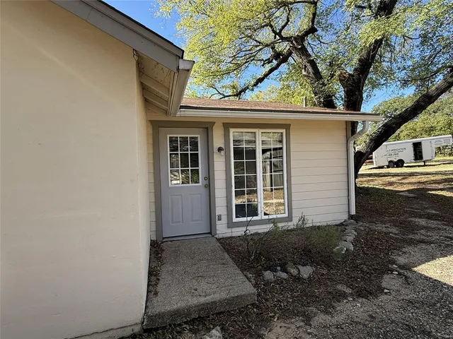 a view of a house with a tree