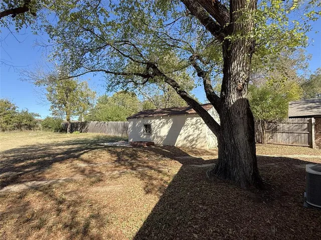a view of a yard with an outdoor space