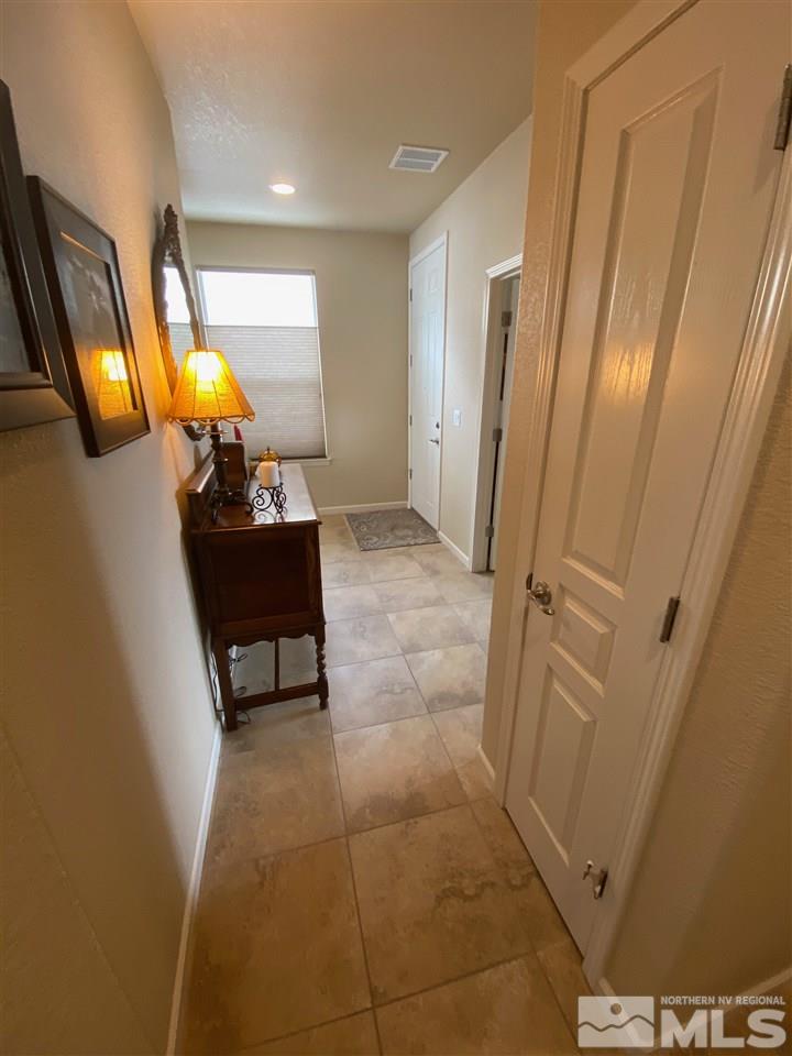 1170 Wakefield Trail Reno, NV 89523 - Photo 25 of 25 a living room with furniture and a mirror