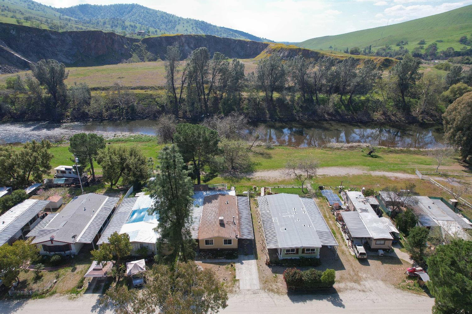 25433 East Trimmer Springs Road, Unit 4 Sanger, CA 93657 - Photo 13 of 33 an aerial view of a house with garden