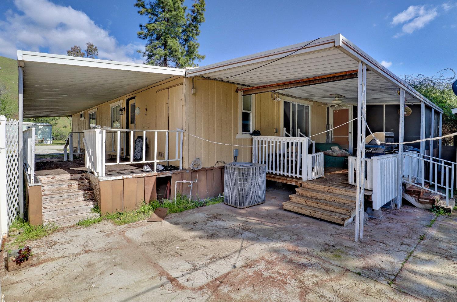 25433 East Trimmer Springs Road, Unit 4 Sanger, CA 93657 - Photo 18 of 33 a view of a house with a porch