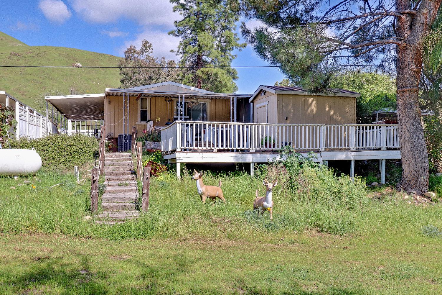 25433 East Trimmer Springs Road, Unit 4 Sanger, CA 93657 - Photo 19 of 33 a view of a house with a yard