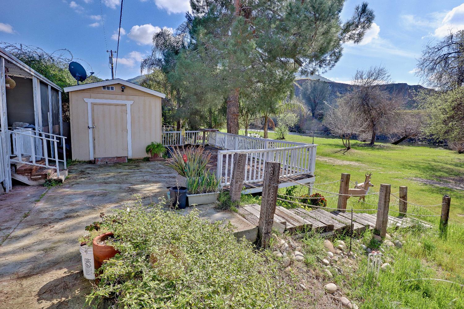 25433 East Trimmer Springs Road, Unit 4 Sanger, CA 93657 - Photo 26 of 33 a view of a house with a yard and sitting area