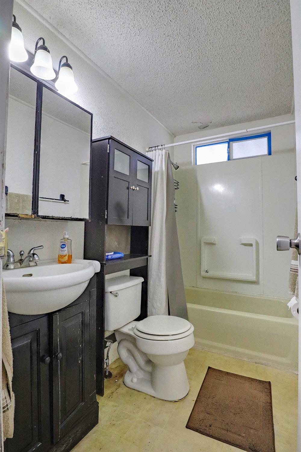 25433 East Trimmer Springs Road, Unit 4 Sanger, CA 93657 - Photo 10 of 33 a bathroom with a sink toilet and shower