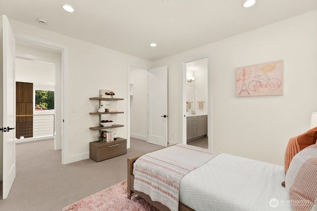 a bedroom with a bed and a couch