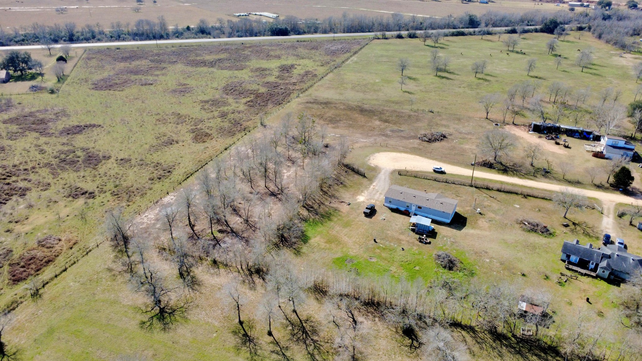 Lot 13 Mesquite Road Wallis, TX 77485 - Photo 3 of 16 an aerial view of a house with a yard