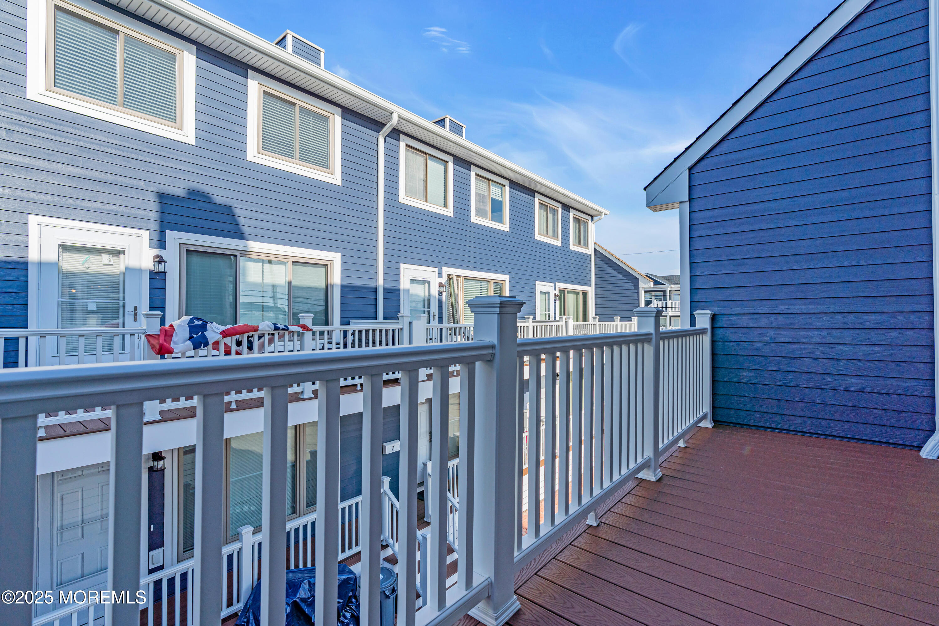 1900 Grand Central Avenue, Unit 3 Lavallette, NJ 08735 - Photo 16 of 21 a view of a brick building from a balcony
