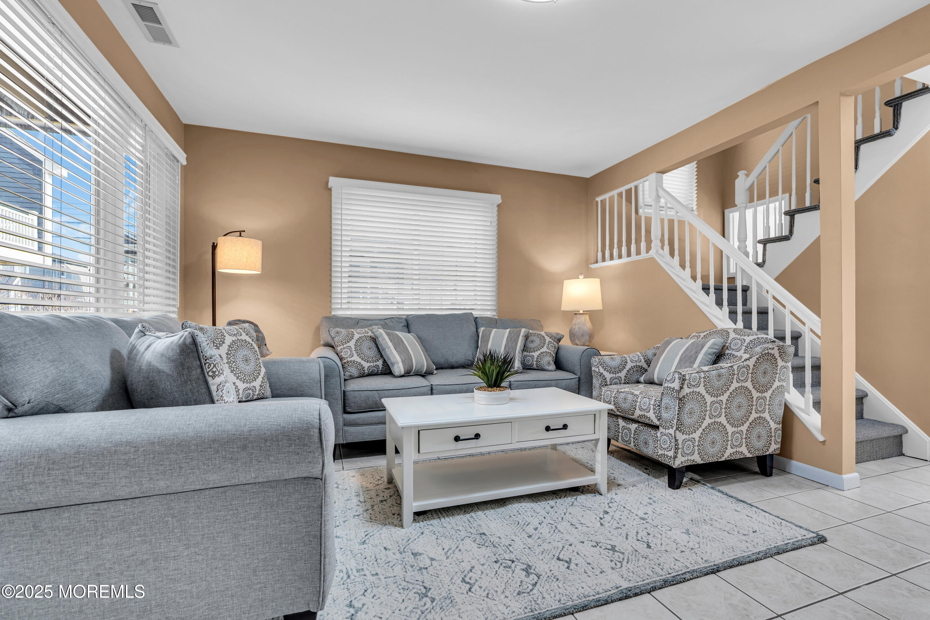1900 Grand Central Avenue, Unit 3 Lavallette, NJ 08735 - Photo 4 of 21 a living room with furniture and a lamp