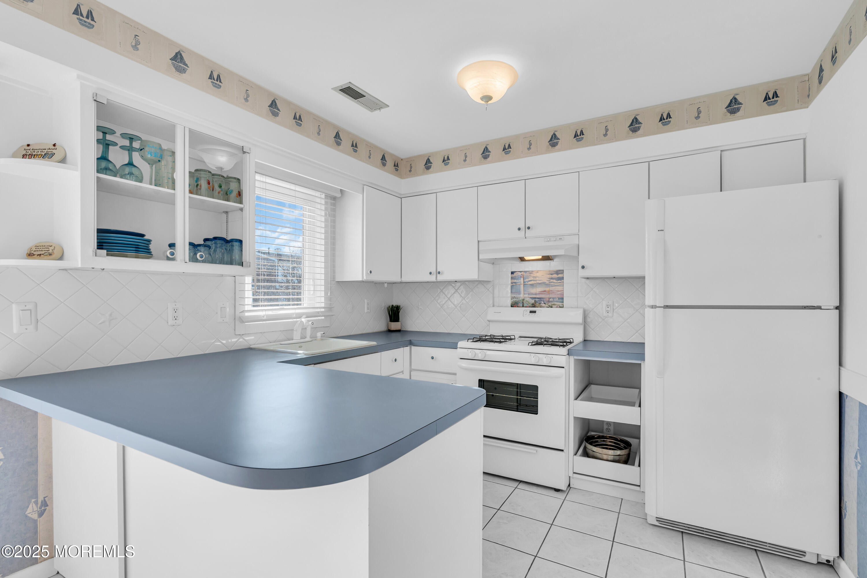 1900 Grand Central Avenue, Unit 3 Lavallette, NJ 08735 - Photo 5 of 21 a kitchen with stainless steel appliances granite countertop a sink stove and refrigerator