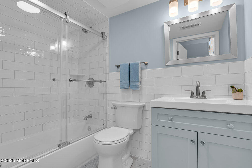 1900 Grand Central Avenue, Unit 3 Lavallette, NJ 08735 - Photo 7 of 21 a bathroom with a sink a toilet and shower