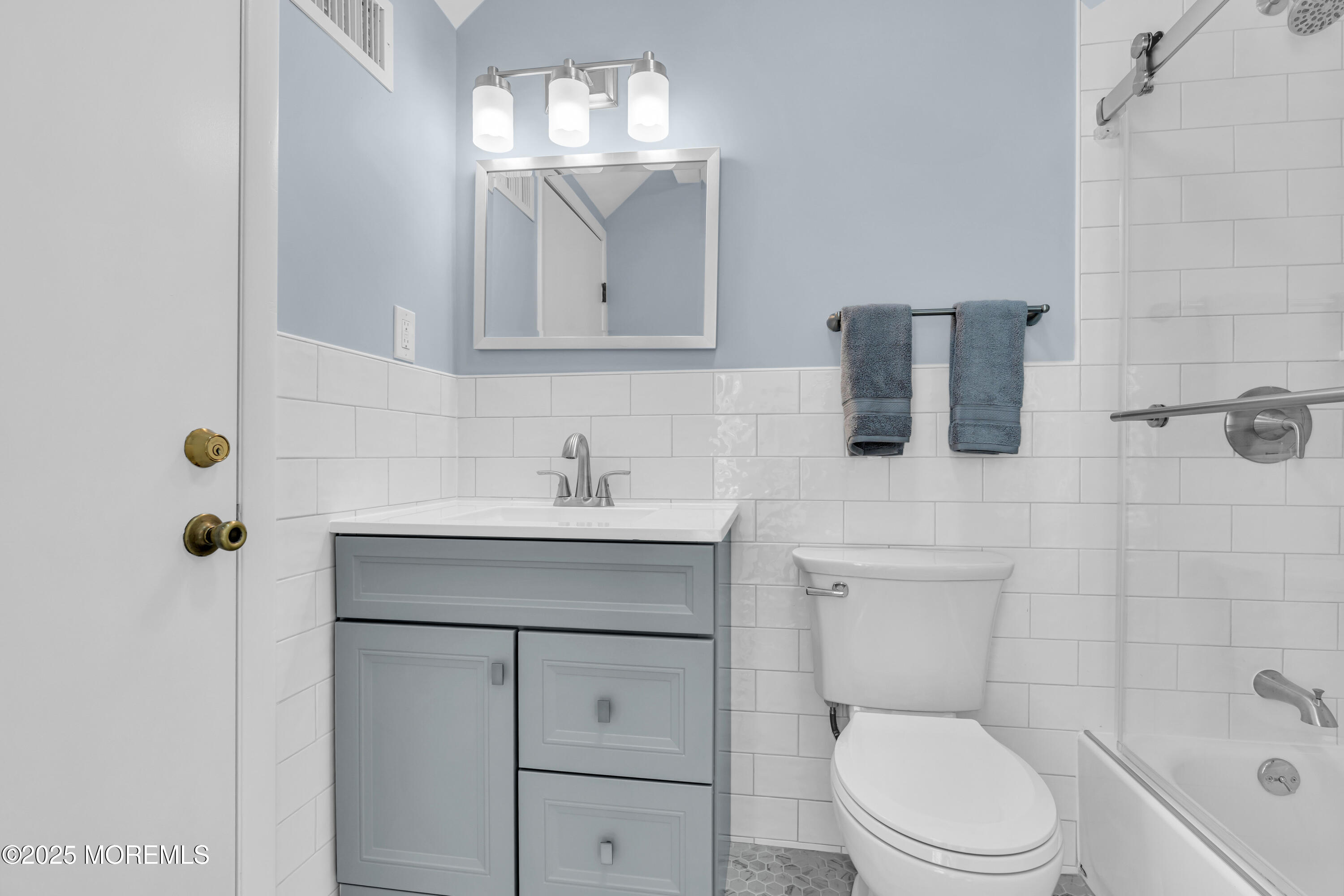 1900 Grand Central Avenue, Unit 3 Lavallette, NJ 08735 - Photo 8 of 21 a bathroom with a sink toilet vanity and shower