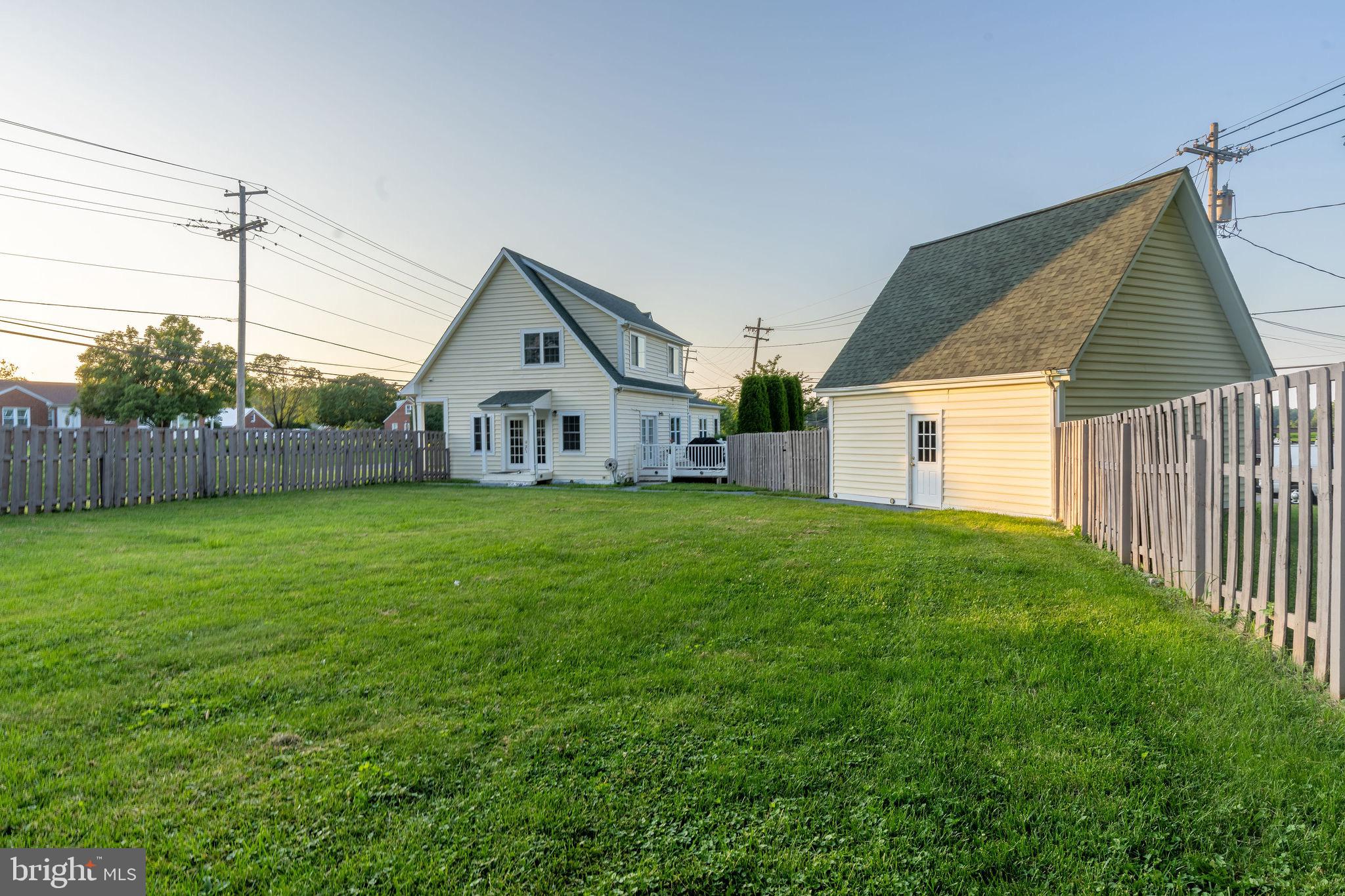 25325 Woodfield Road Damascus, MD 20872 - Photo 12 of 58 a view of a house with backyard and garden