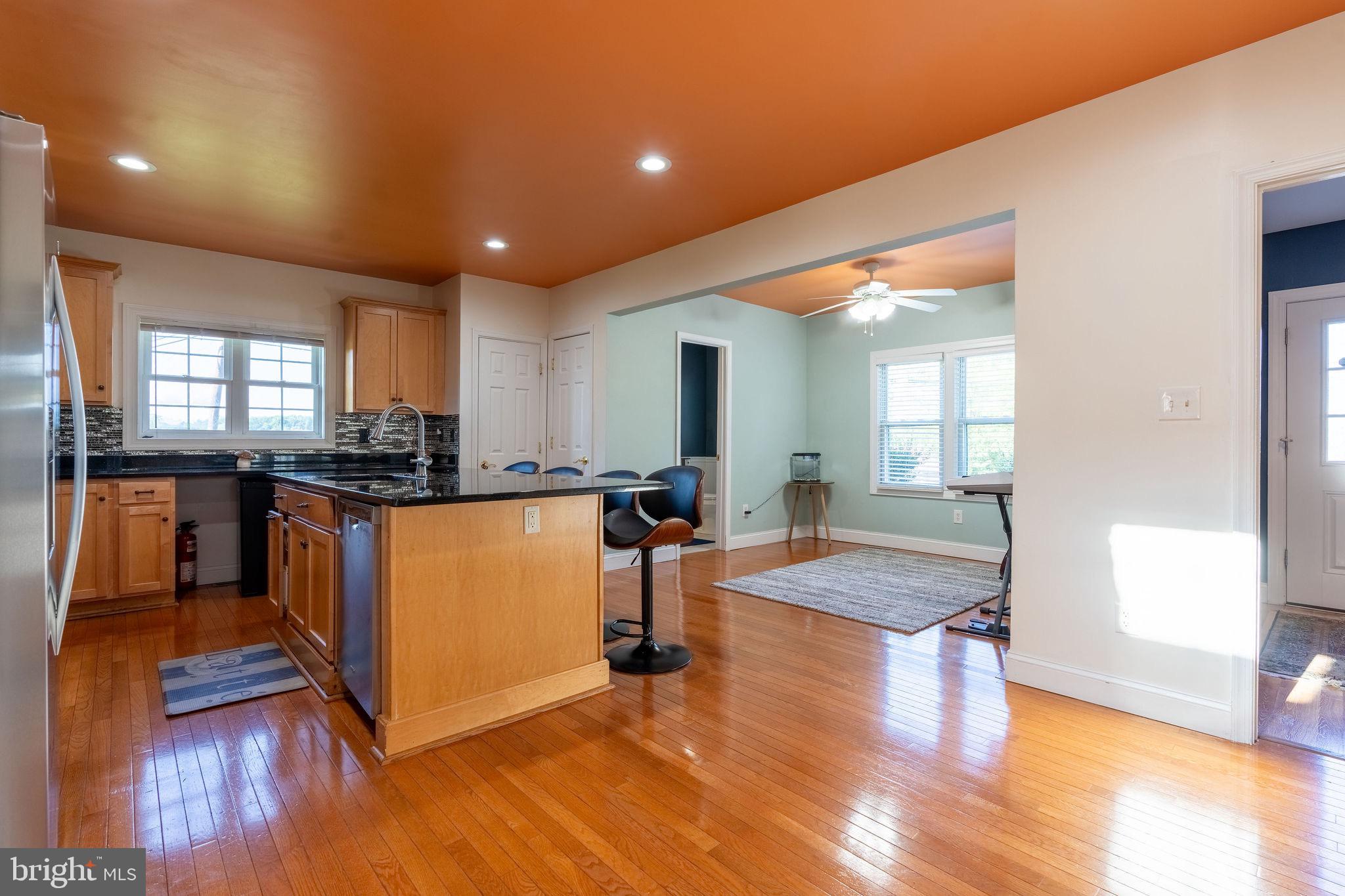 25325 Woodfield Road Damascus, MD 20872 - Photo 32 of 58 a view of kitchen with cabinets and wooden floor