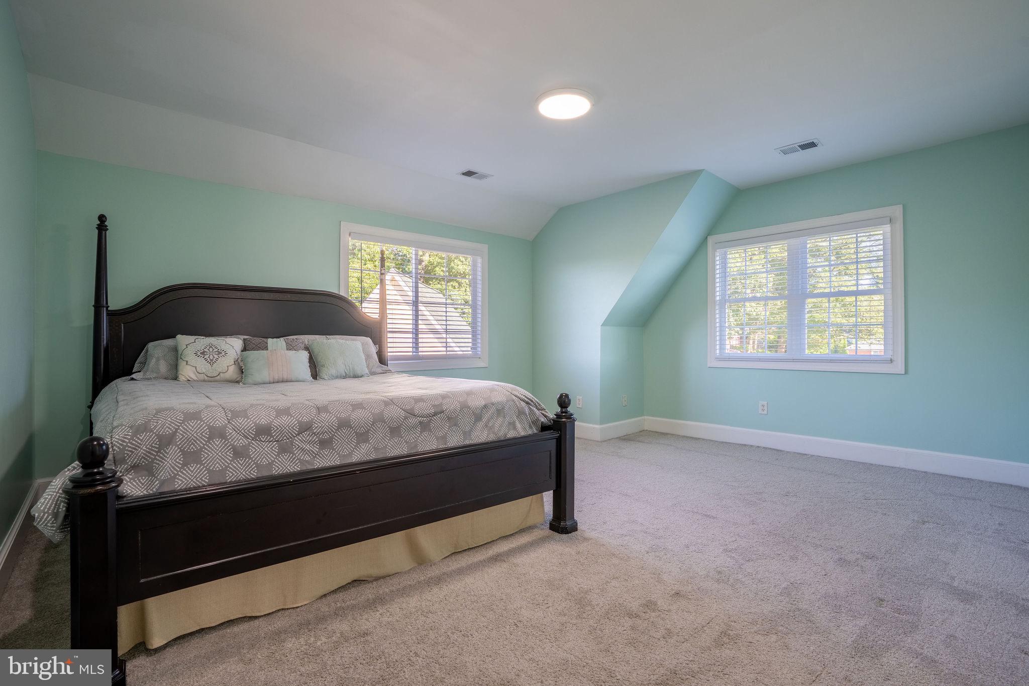 25325 Woodfield Road Damascus, MD 20872 - Photo 38 of 58 a bedroom with a bed and a window