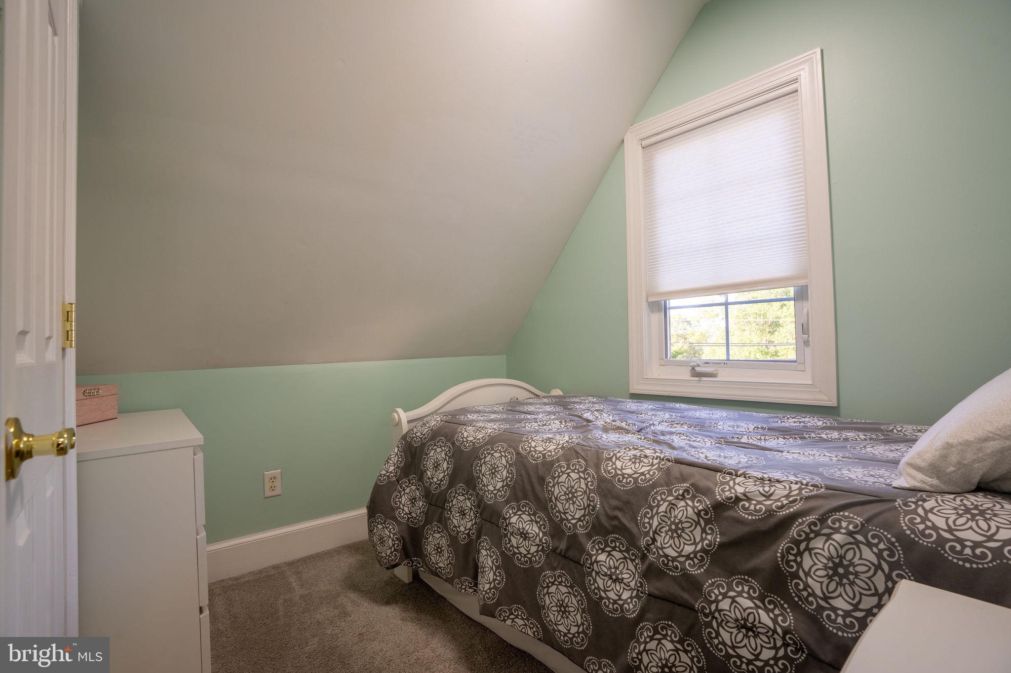 25325 Woodfield Road Damascus, MD 20872 - Photo 47 of 58 a bedroom with a bed and a window