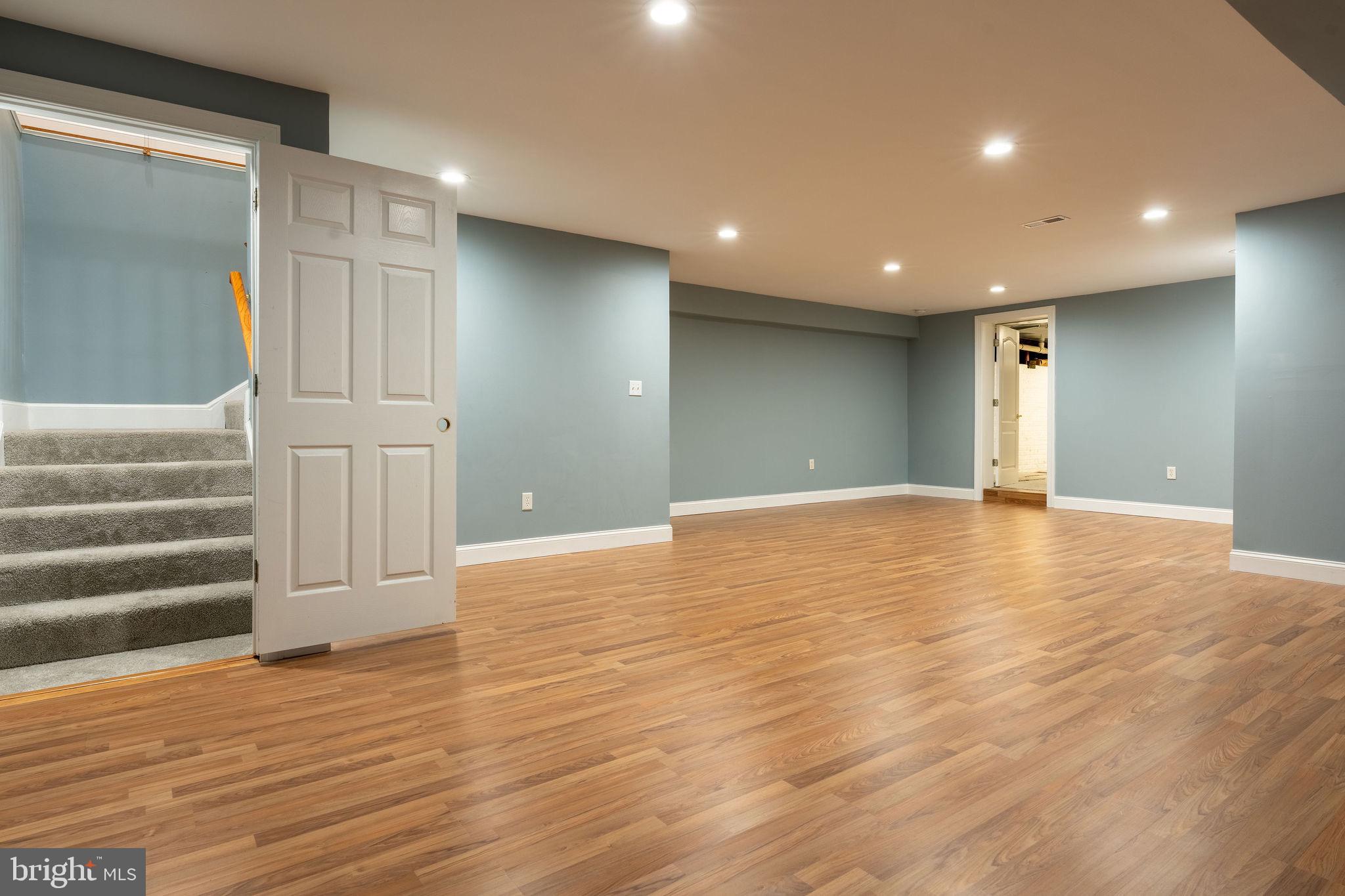 25325 Woodfield Road Damascus, MD 20872 - Photo 50 of 58 a view of empty room with wooden floor and fan