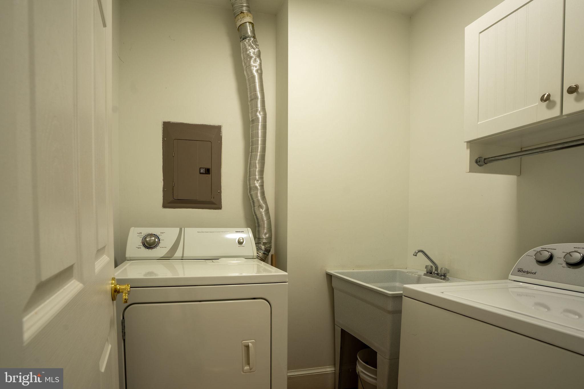 25325 Woodfield Road Damascus, MD 20872 - Photo 56 of 58 a utility room with dryer and washer