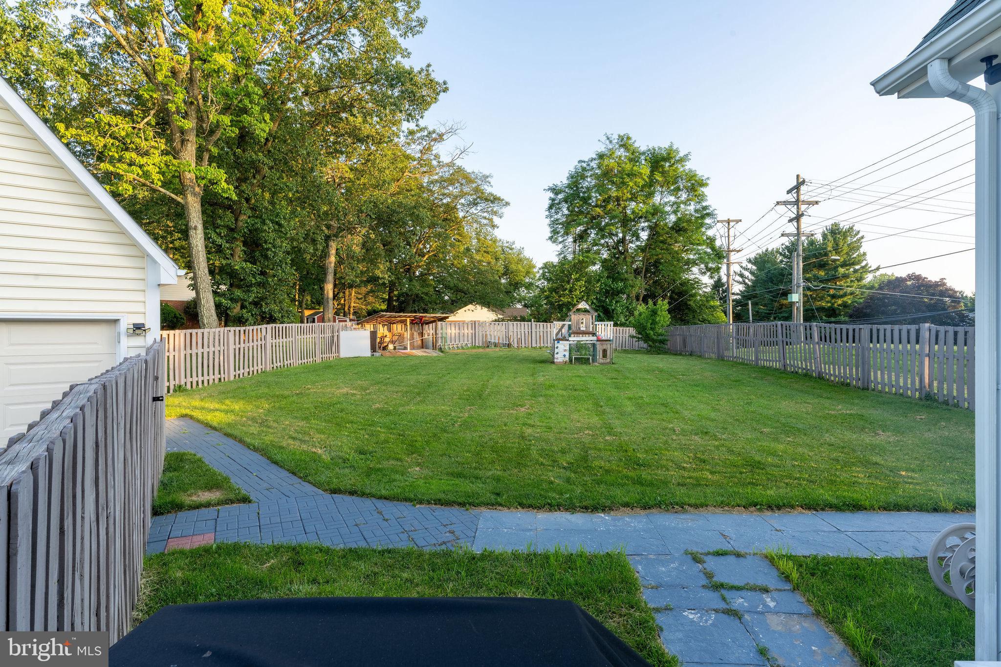 25325 Woodfield Road Damascus, MD 20872 - Photo 10 of 58 a view of a backyard with a garden