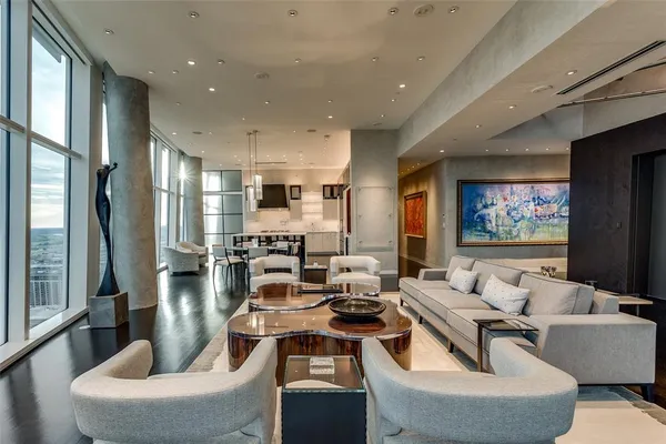 a living room with fireplace furniture and a flat screen tv