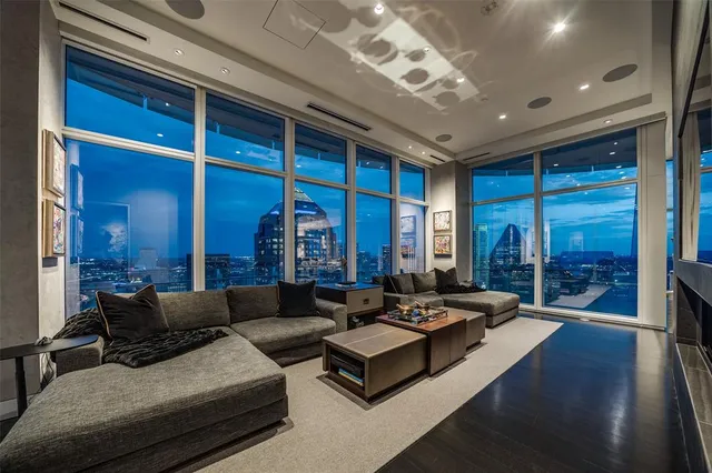 a living room with furniture and large window