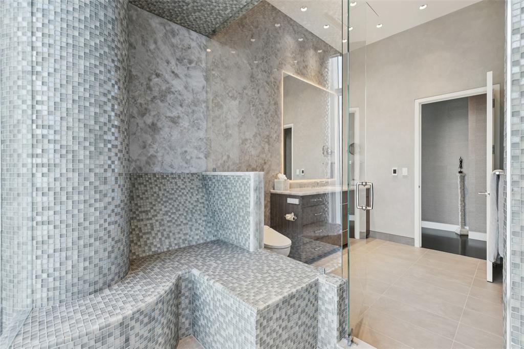 1918 Olive Street, Unit 4202 Dallas, TX 75201 - Photo 25 of 37 a spacious bathroom with a granite countertop sink a toilet and shower