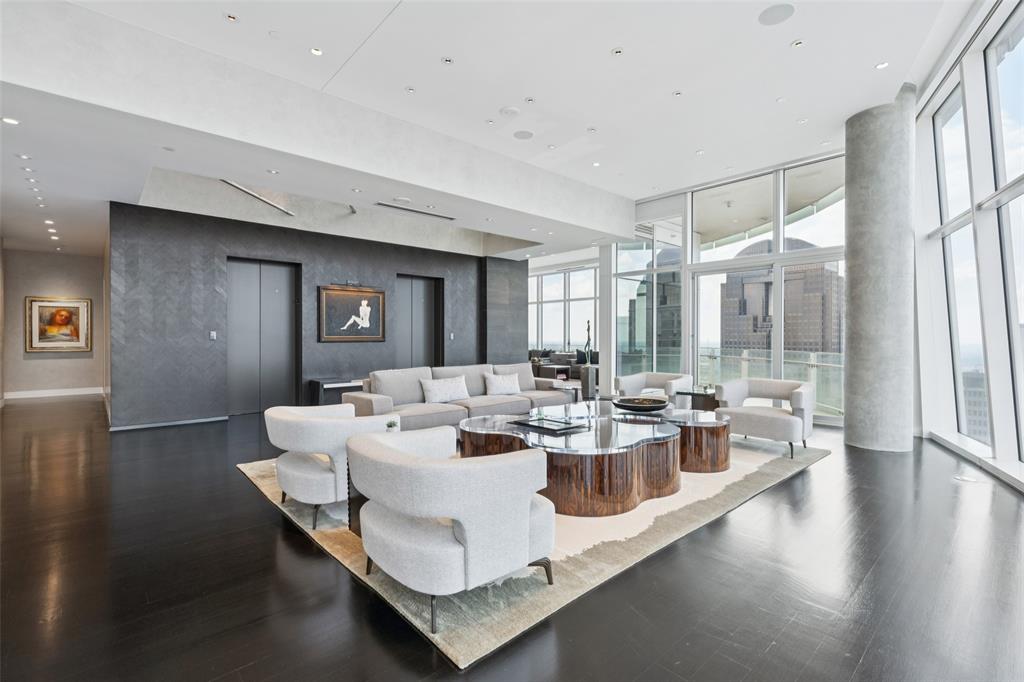 1918 Olive Street, Unit 4202 Dallas, TX 75201 - Photo 5 of 37 a view of a dining room with furniture a chandelier and wooden floor