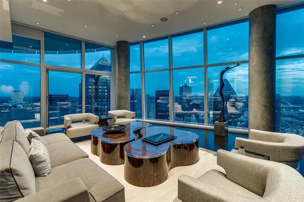 a living room with furniture and outdoor view