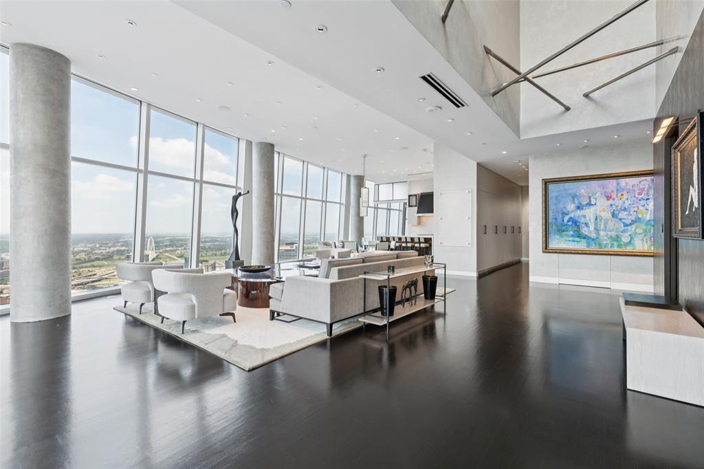 1918 Olive Street, Unit 4202 Dallas, TX 75201 - Photo 7 of 37 a living room with couches a coffee table and a large window with outer view