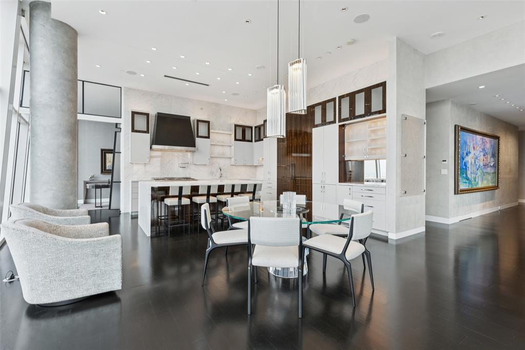 1918 Olive Street, Unit 4202 Dallas, TX 75201 - Photo 10 of 37 a living room with fireplace furniture and a flat screen tv