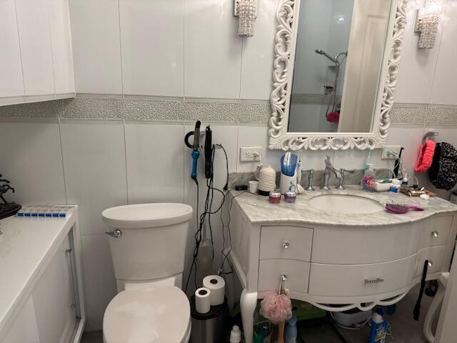 5544 Fox Hollow Drive Boca Raton, FL 33486 - Photo 14 of 22 a bathroom with a sink toilet and mirror
