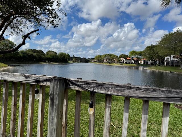 5544 Fox Hollow Drive Boca Raton, FL 33486 - Photo 2 of 22 a view of a lake with a city from a balcony