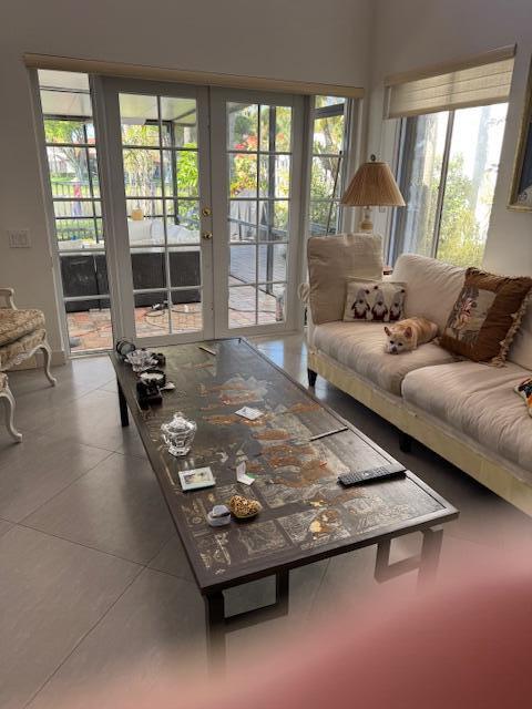 5544 Fox Hollow Drive Boca Raton, FL 33486 - Photo 4 of 22 a living room with furniture rug and a large window