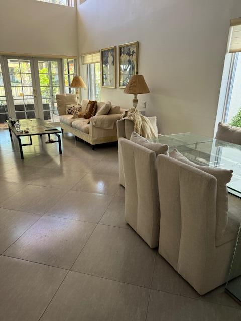 5544 Fox Hollow Drive Boca Raton, FL 33486 - Photo 5 of 22 a living room with furniture and a large window