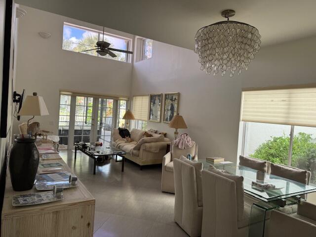 5544 Fox Hollow Drive Boca Raton, FL 33486 - Photo 9 of 22 a living room with furniture and chandelier