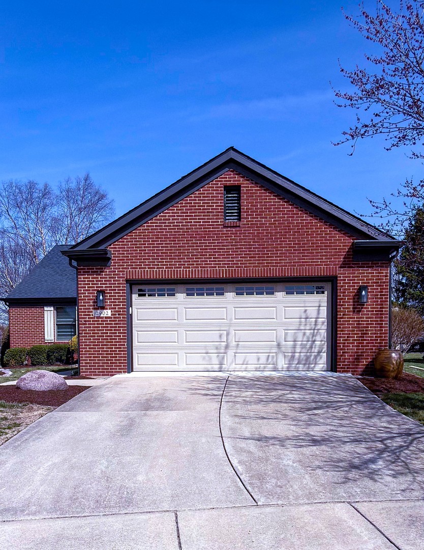 2902 Greystone Place Champaign, IL 61822 - Photo 1 of 35 a front view of a house with a yard