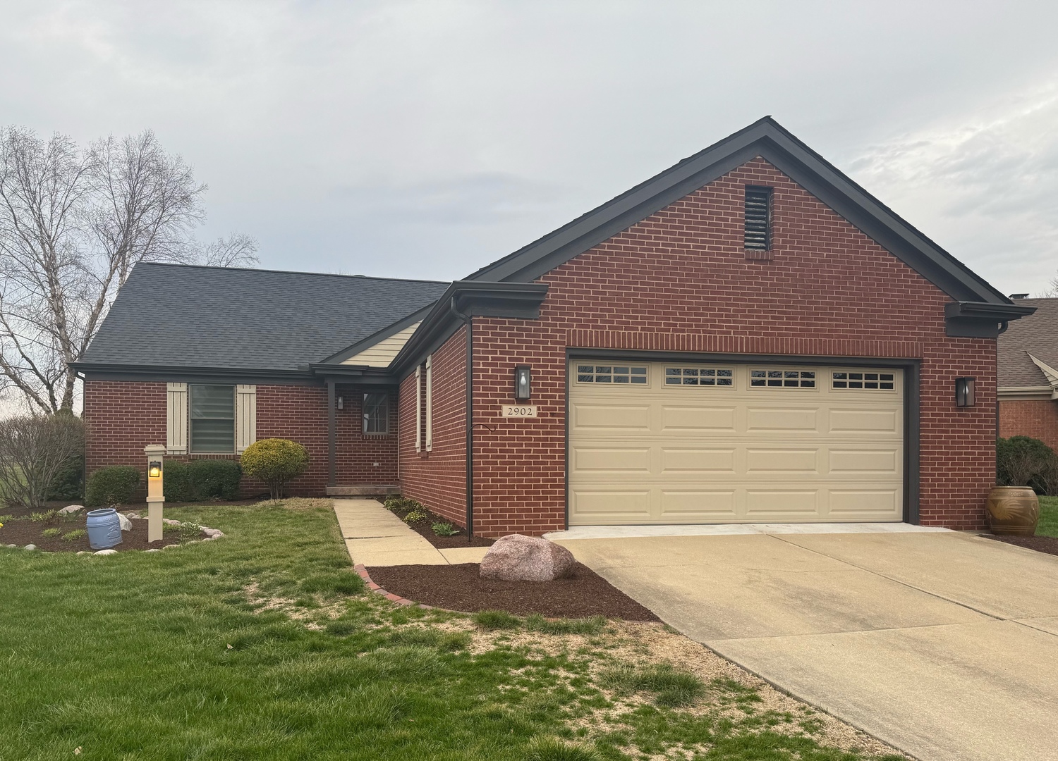 2902 Greystone Place Champaign, IL 61822 - Photo 2 of 35 a front view of a house with garden