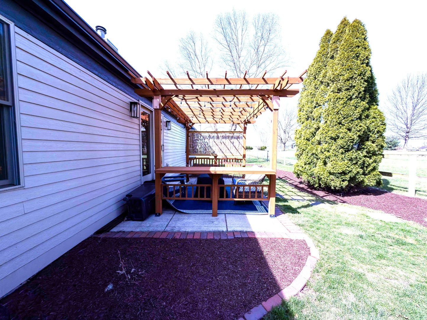 2902 Greystone Place Champaign, IL 61822 - Photo 32 of 35 a backyard of a house with barbeque oven table and chairs