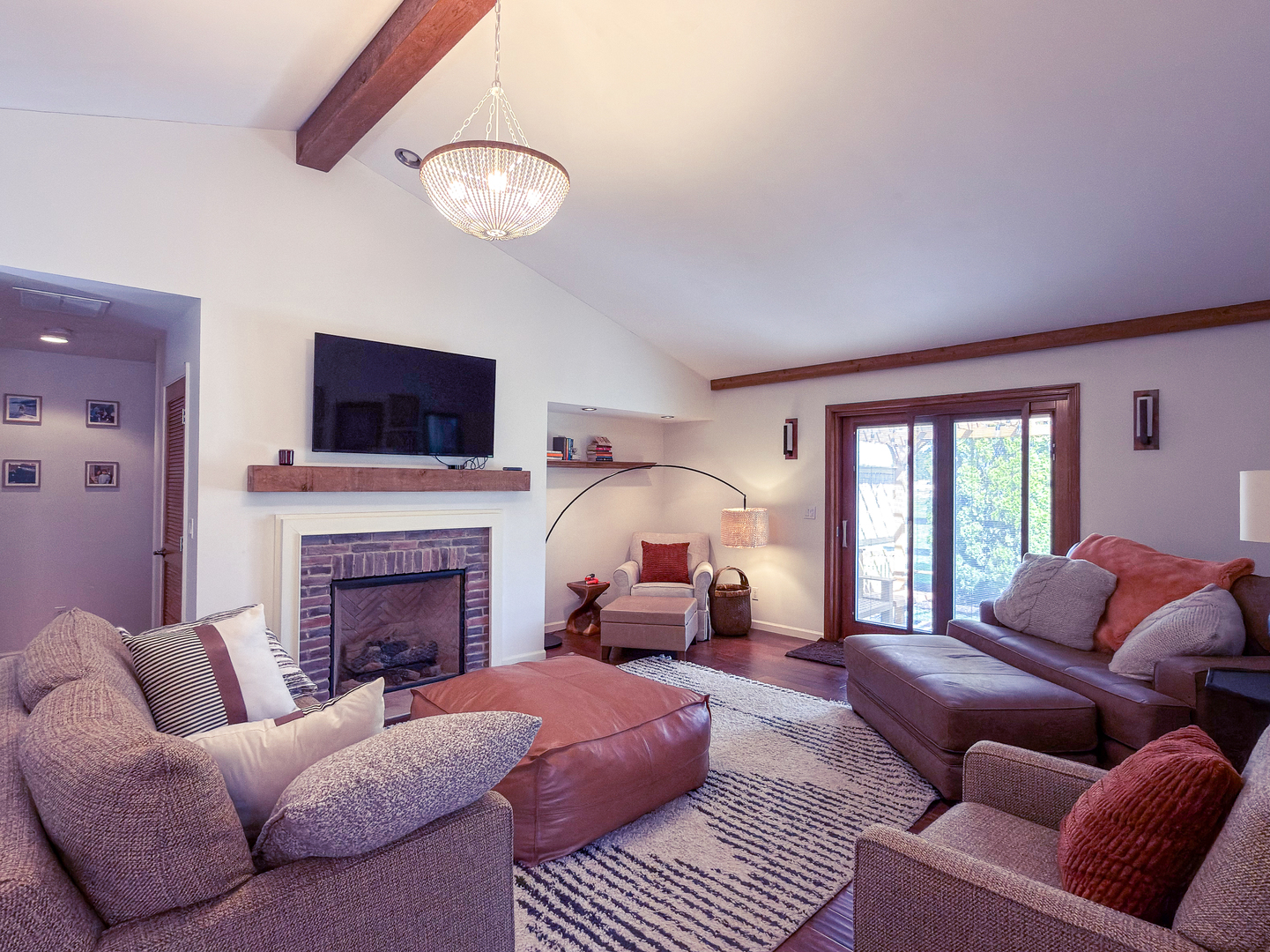 2902 Greystone Place Champaign, IL 61822 - Photo 5 of 35 a living room with furniture a fireplace and a flat screen tv