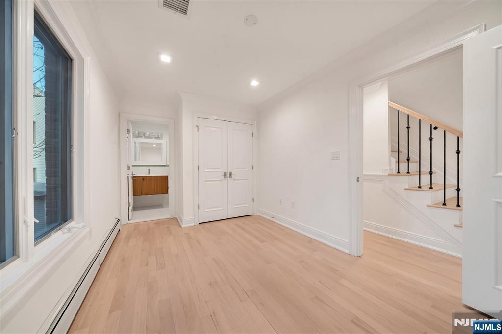 516 Undercliff Avenue Edgewater, NJ 07020 - Photo 23 of 32 a view of a livingroom with wooden floor