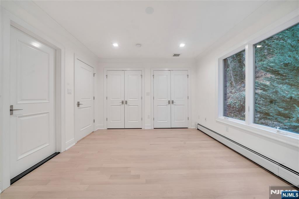 516 Undercliff Avenue Edgewater, NJ 07020 - Photo 26 of 32 a view of an empty room with a window