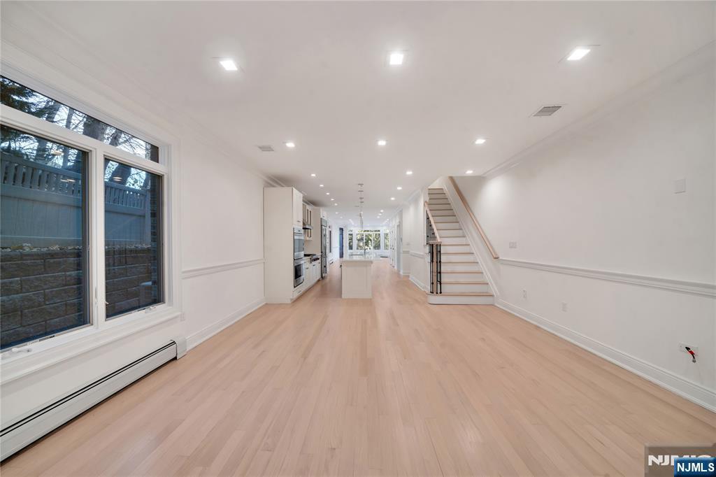 516 Undercliff Avenue Edgewater, NJ 07020 - Photo 10 of 32 a view of a hall with wooden floor