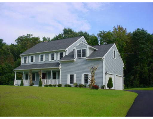 240 Gleasondale Road Stow, MA 01775 - Photo 1 of 13 a front view of a house with a garden