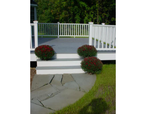 240 Gleasondale Road Stow, MA 01775 - Photo 2 of 13 a view of a porch with a chair