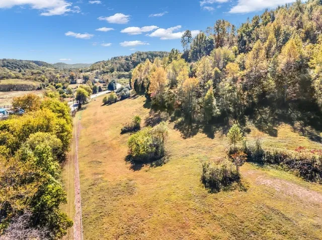 a aerial view of a house with a yard