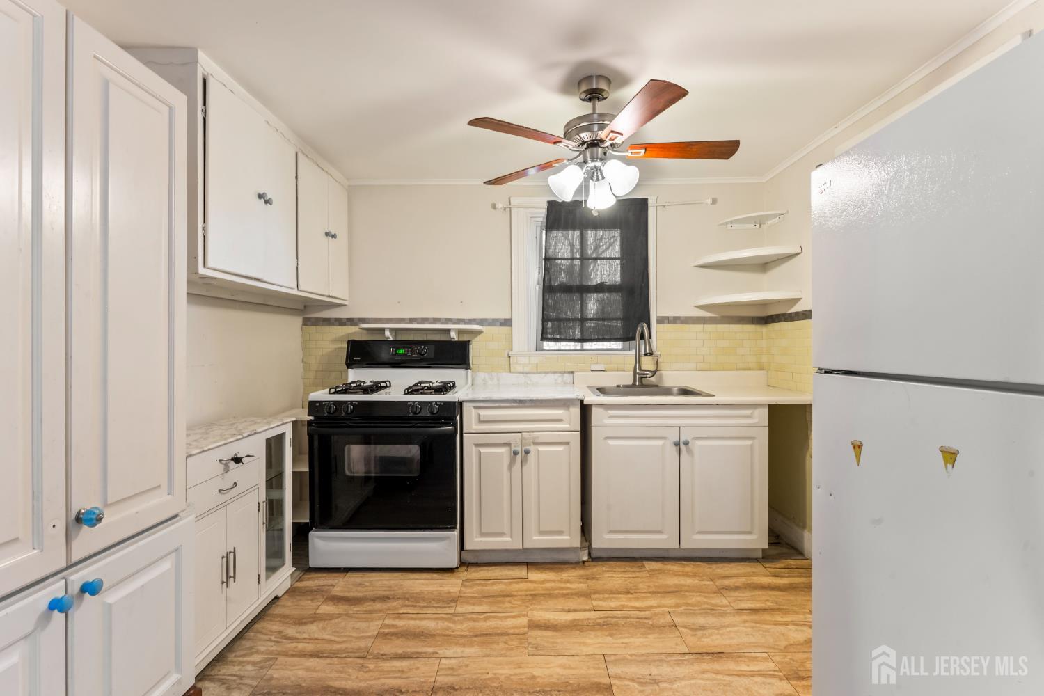 45 Loring Avenue Edison, NJ 08817 - Photo 6 of 23 a kitchen with stainless steel appliances granite countertop a stove a sink and a refrigerator